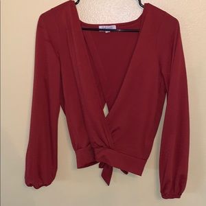 orange long sleeve shirt with knot